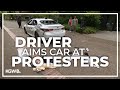 Driver rolls toward protesters on Portland State University camps, launching pepper spray