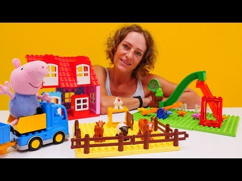 Peppa Wutz Spielzeug. Schorsch spielt mit Lego