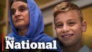Yazidi boy held captive by ISIS reunited with mother in Winnipeg