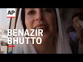 AP pix of Benazir Bhutto on plane from Dubai, arrival, her speaking
