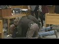 Father of victims lunges at Larry Nassar in court