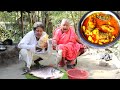 Grandmother special village cooking recipe Giant Taro with Fish curry for their lunch menu
