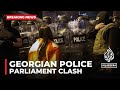 Georgian police fire tear gas and water cannons at protesters outside Parliament building