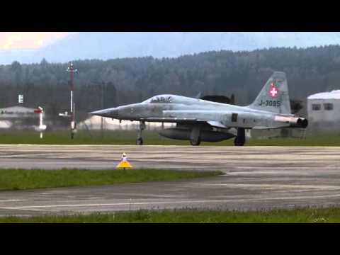 Download Emmen Airbase: take-off of two F5-E Tiger jets on a rather rainy morning. free