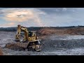 Excavator Komatsu PC2000 Loading Trucks Caterpillar OHT 777D