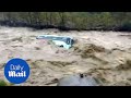 Shocking moment monsoon floods cause bus to be swept away