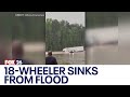 18-wheeler goes off road, submerges during heavy flooding in Houston area