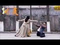 Kung Fu Movie! The young man arrogantly challenges a Kung Fu girl, only to be defeated by her.