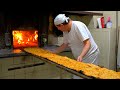 Two-meter long pizzas baked in a century-old wood-fired oven!
