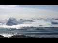 Ilulissat Icefjord - Large iceberg breaking over