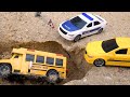 Police cars help the bus escape the sand pit
