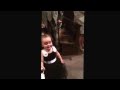 Funny flower girl stops mid aisle to say hi to dad