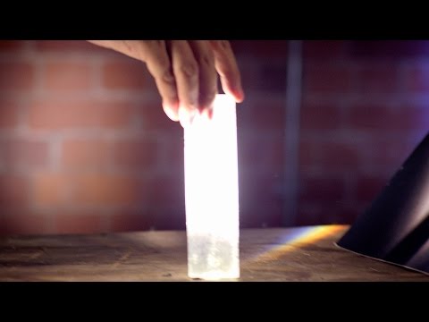 Why is a specific beam of light seen when a flashlight is shined on a mirror?