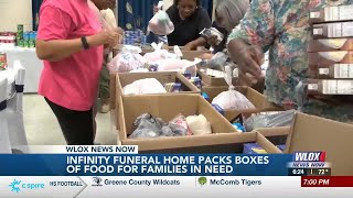 Infinity Funeral Home boxes meals for the community