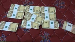 NEW INDIAN TEN rupee note bundle unwrapping