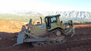 Caterpillar D8T pushing rocks