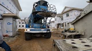 Never had these concrete trucks empty into our pumps before! Pumping concrete with Muddyfeet