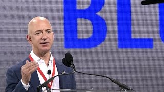 Billionaires Jeff Bezos and Elon Musk compete in space