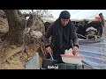 iran nomadic life building a platform in front of the cub shelter with natural stones