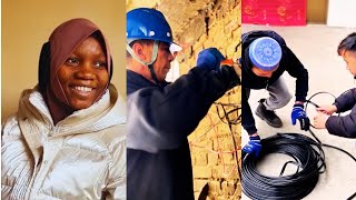 Electricians in Mahasan District repair the wires for Asiya and Zekerenya's family