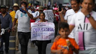 Political protests in Peru as rival groups march through the capital city Lima