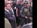 The three leaders and Romanian President Klaus Iohannis were shown gutted burnt-out buildings