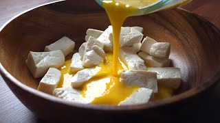 Cut the tofu into large pieces and pour the egg mixture over it to make a filling meal.