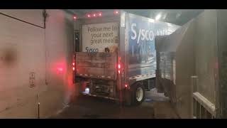 Sysco Truck driver hits wall and dumpster as FedEx employee helps