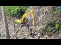 hyundai rock breaker crushing and breaking rocks blocks road