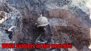 EXCAVATIONS OF GERMAN AND SOVIET SOLDIERS WITH WEAPONS