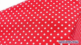 Red Michael Miller fabric with small white polka dots