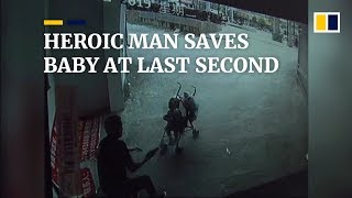 Heroic man saves baby at last second