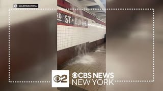 Water pours into some NYC subways