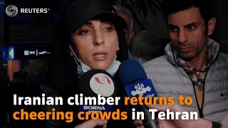 Iranian climber returns to cheering crowds in Tehran