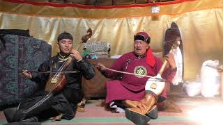 Andre Mongush and Aidyn Sedi sing Manchyremni in a yurt