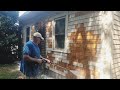 soft washing a house after scraping and sanding