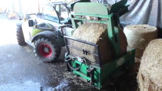 04 Loading A Round Bale Into The Mini (Wrapping Removed Before)