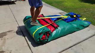 How To Easily Roll Up A Water Slide Inflatable With Dolly Winch - Bounce House