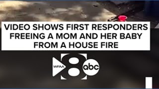 Video shows first responders freeing a mom and her baby from a house fire