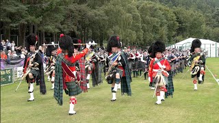 Scotland the Brave as the massed Pipe Bands march in for tribute during 2023 Ballater Highland Games