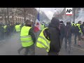 Police fire water cannons at yellow vest protesters in Paris