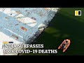 India passes 300,000 coronavirus deaths as mass graves found along Ganges