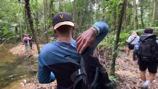 Trekking out of Tumpor Hilltop towards another campsite at Tumpor Mountain ដើរចេញពីកំពូលភ្នំទំព័រ