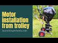 Outboard motor installation on boat from trolly