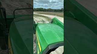 John Deere tractor pulling a subsoiler