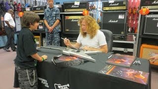 Dave Mustaine of Megadeth signing Vince Minogue's (Wireless Soul) commemorative Dean guitar 07.19.13