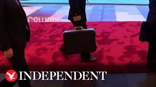 Putin accompanied by alleged 'nuclear briefcase' in China