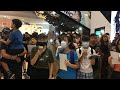 Hong Kongers gather at mall to sing protest anthem | AFP