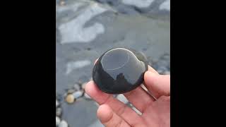 A Concretion that has eroded out from the sedimentary rock layers of the Cliffs of Moher