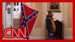 Man with Confederate flag in Capitol identified and arrested